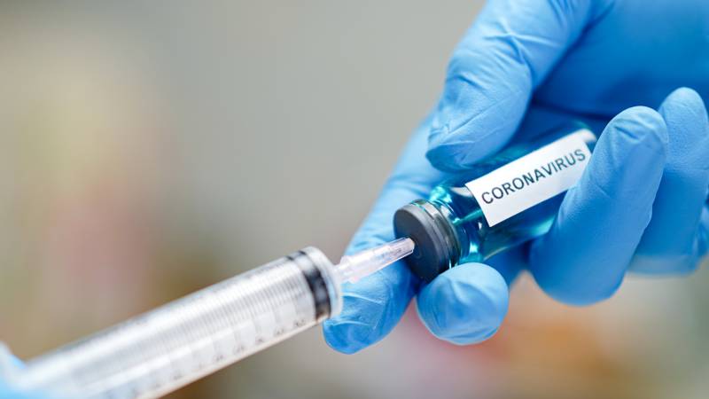 Cropped Hand Of Scientist Holding Syringe