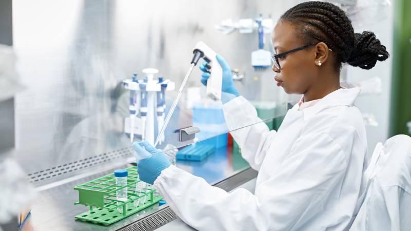 Scientist analyzing medical sample in laboratory