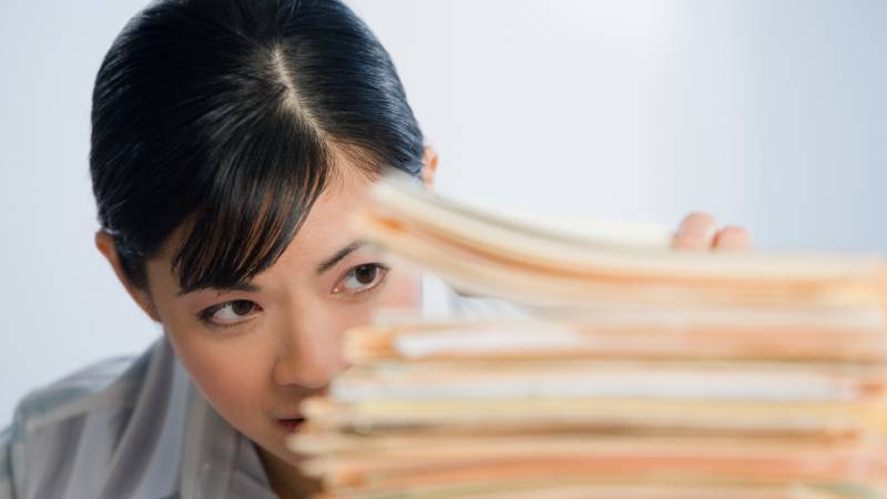 woman looking at folders