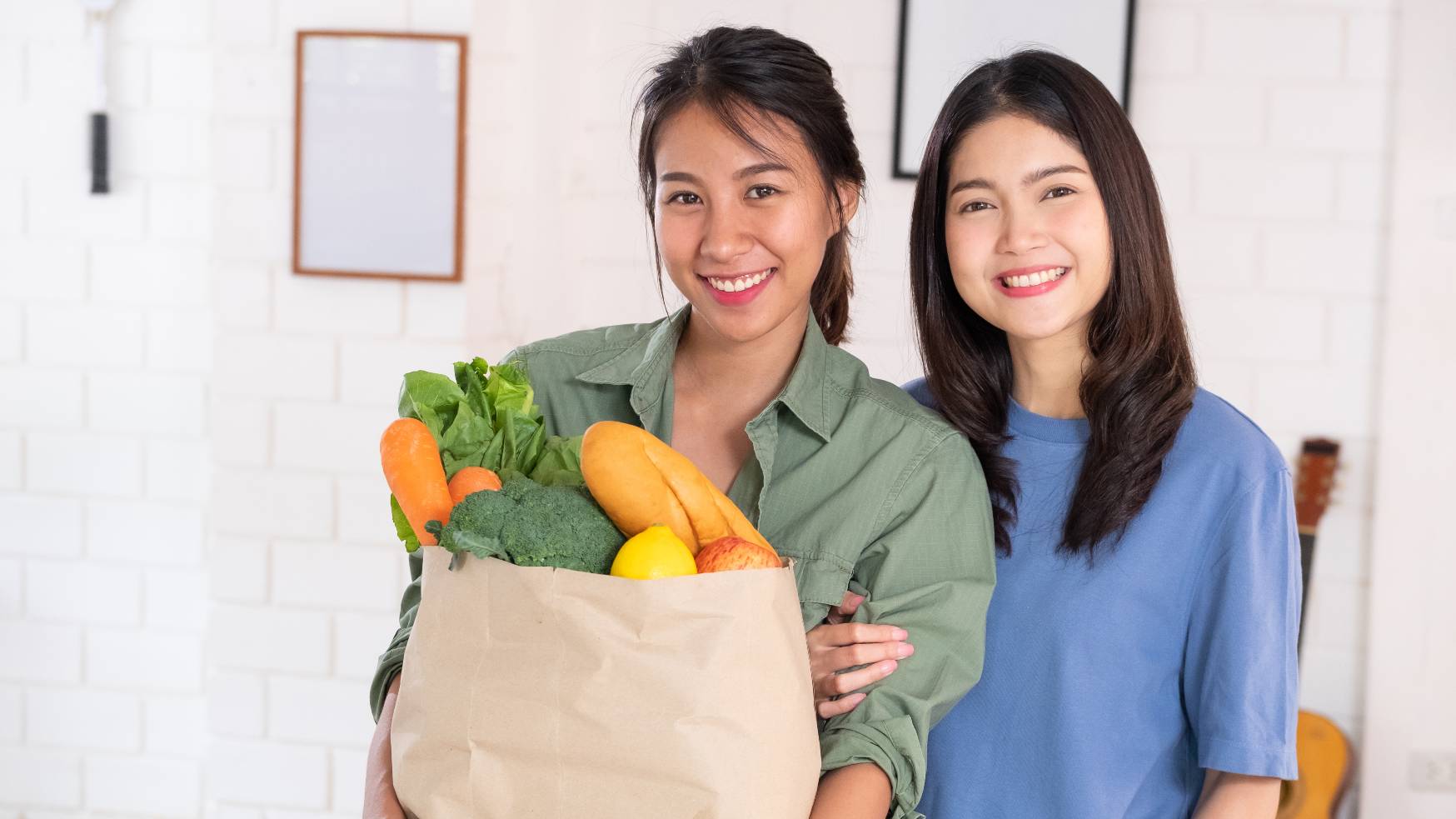 happy couple with vegan groceries