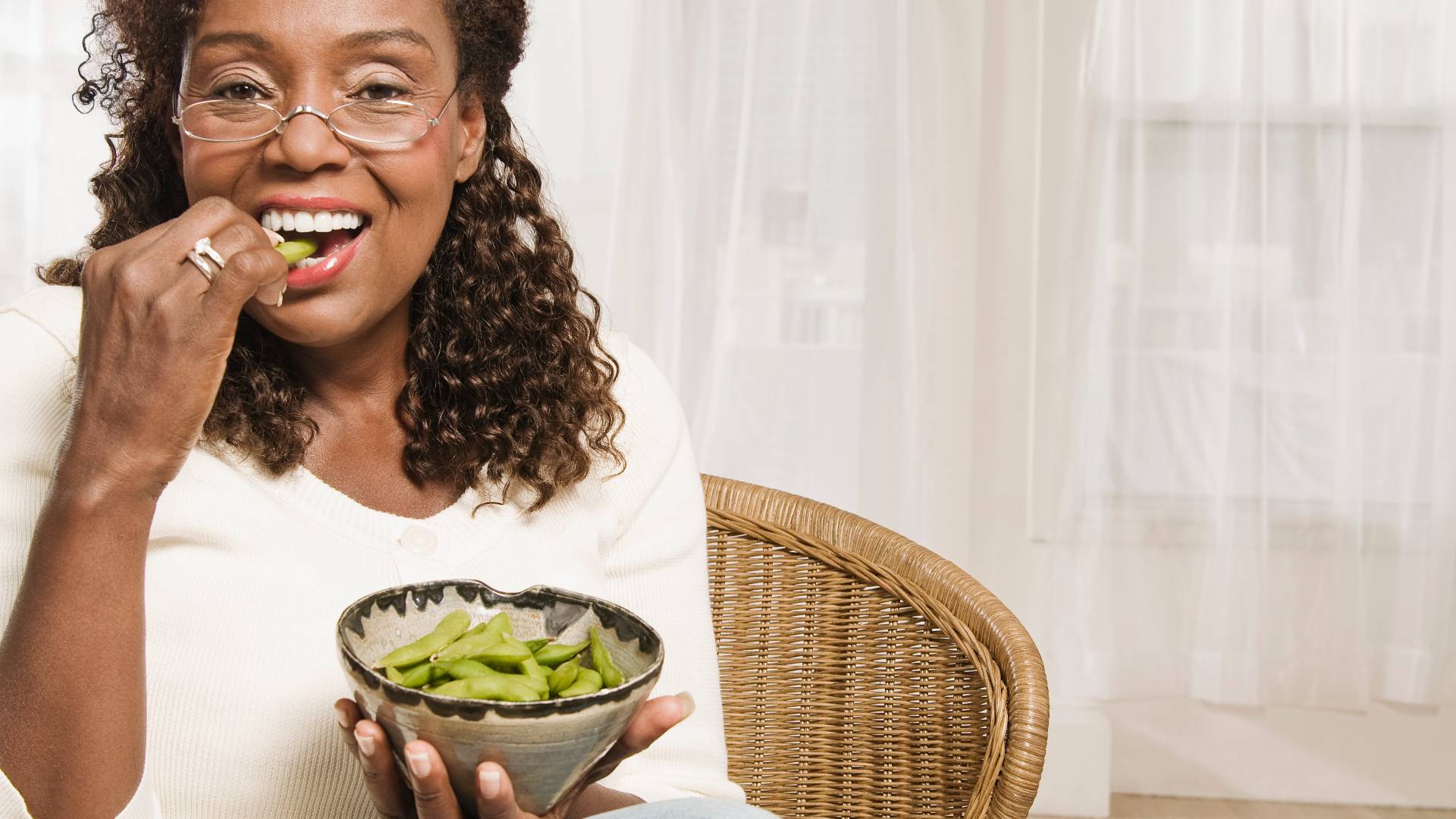 woman eating edamame