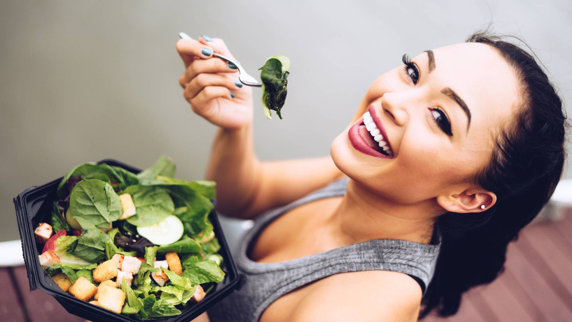 woman eating salad