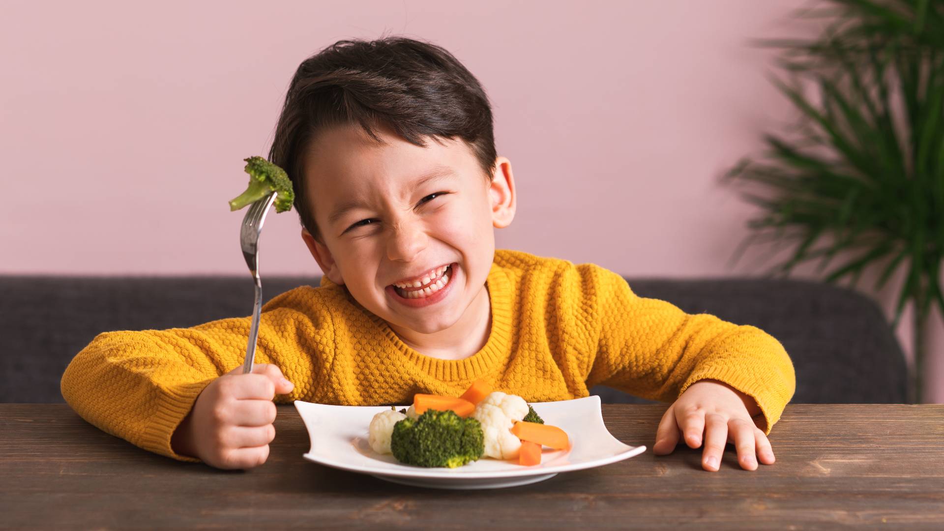 happy child eating vegetables