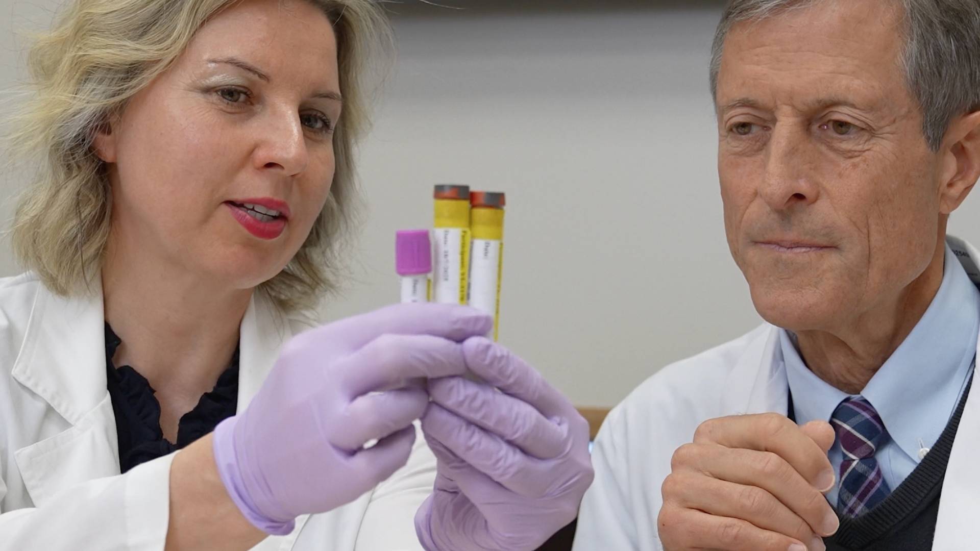 Dr. Hana Kahleova and Dr. Neal Barnard, two experts featured in Reversing Diabetes, examining vials.