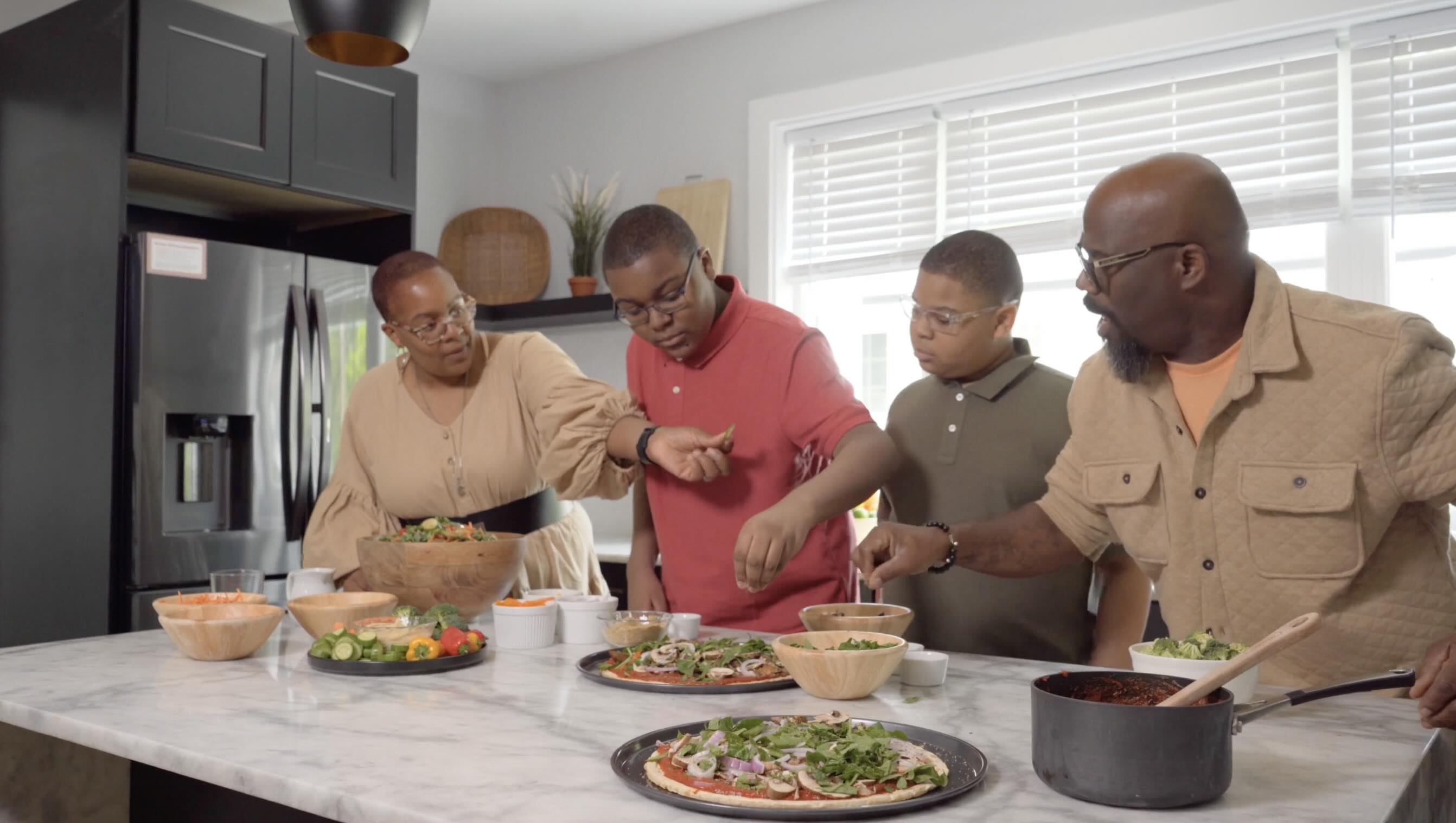 One of the film’s success stories, Donna Jackson, enjoying a nourishing meal with her husband, Zavorio Jackson, and two sons.