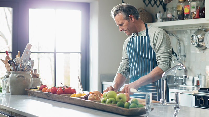 Man cutting fruits and vegetables