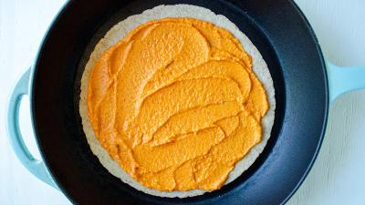 quesadilla in pan spread chickpea mixture