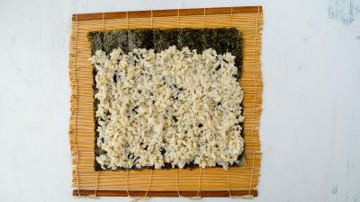sushi bites rice on nori sheet